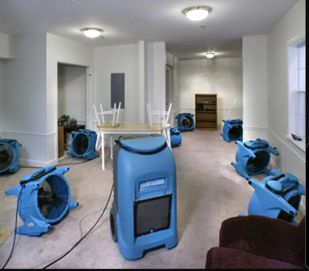 Air movers and dehumidifier setup for Water Damage Restoration in East Bradford