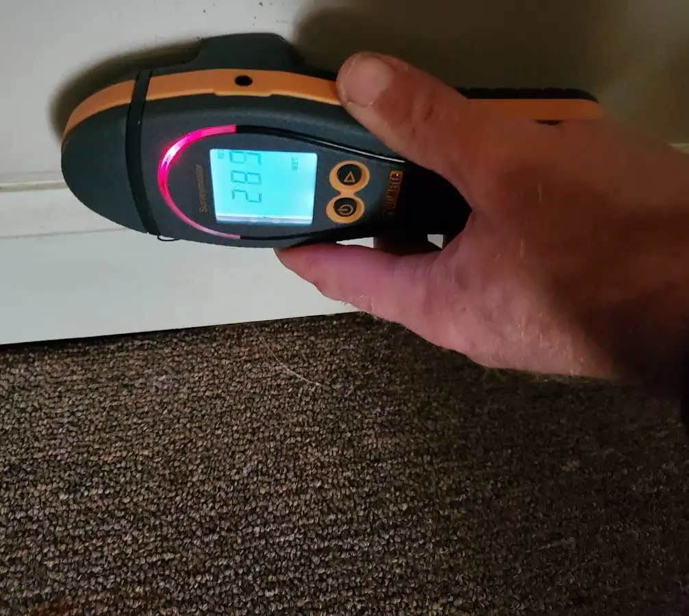 Moisture detection at baseboard during Storm Damage Restoration in East Bradford
